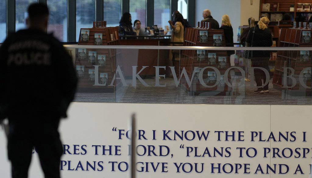 A police officer stands at the top of the steps inside Lakewood Church on Feb. 18, 2024, in Houston. (AP)