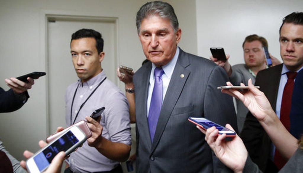 Sen. Joe Manchin, D-W.Va., talks with reporters as he walks on Capitol Hill, Sept. 24, 2018. (AP/Alex Brandon)