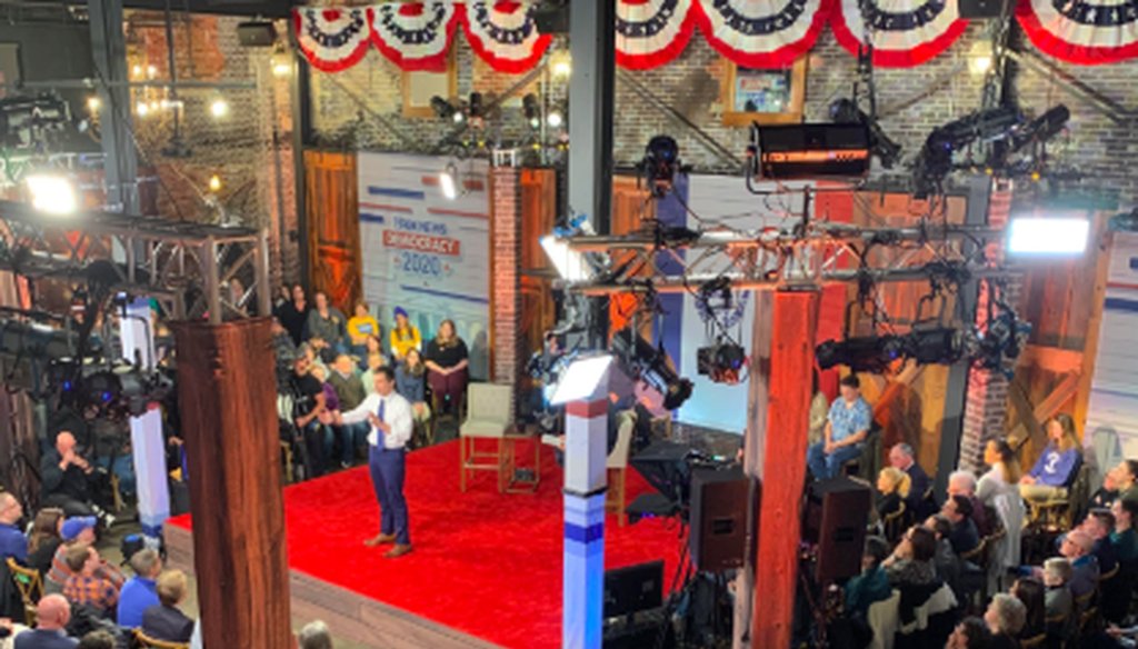 Members of the public watch Pete Buttigieg's closing statement at a Fox News town hall in Des Moines, Iowa, on Jan. 26, 2020. (Tina Dyakon/PolitiFact)
